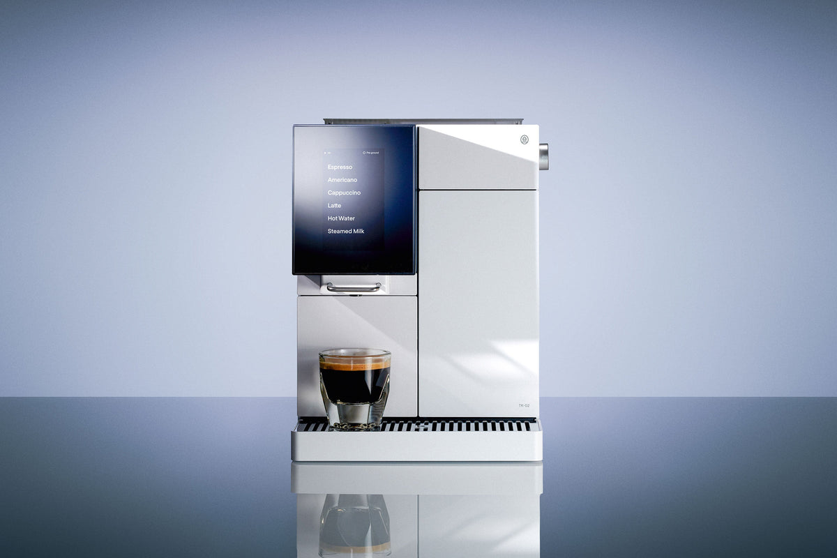 Photo of White TK-02, with espresso, on Blue Studio background